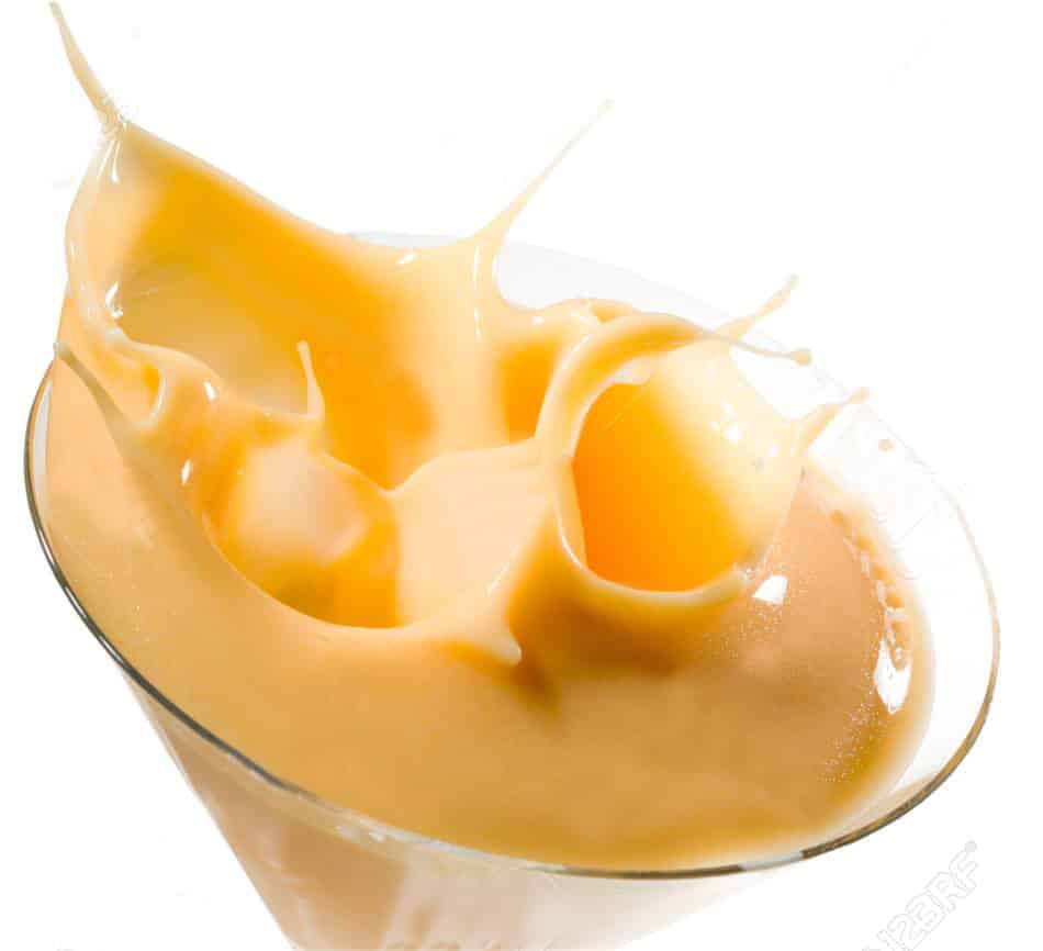 egg liqueur splashing in glass, isolated on white background, cl advocaat egg liqueur, splashing, isolated on white background, clipping path included
